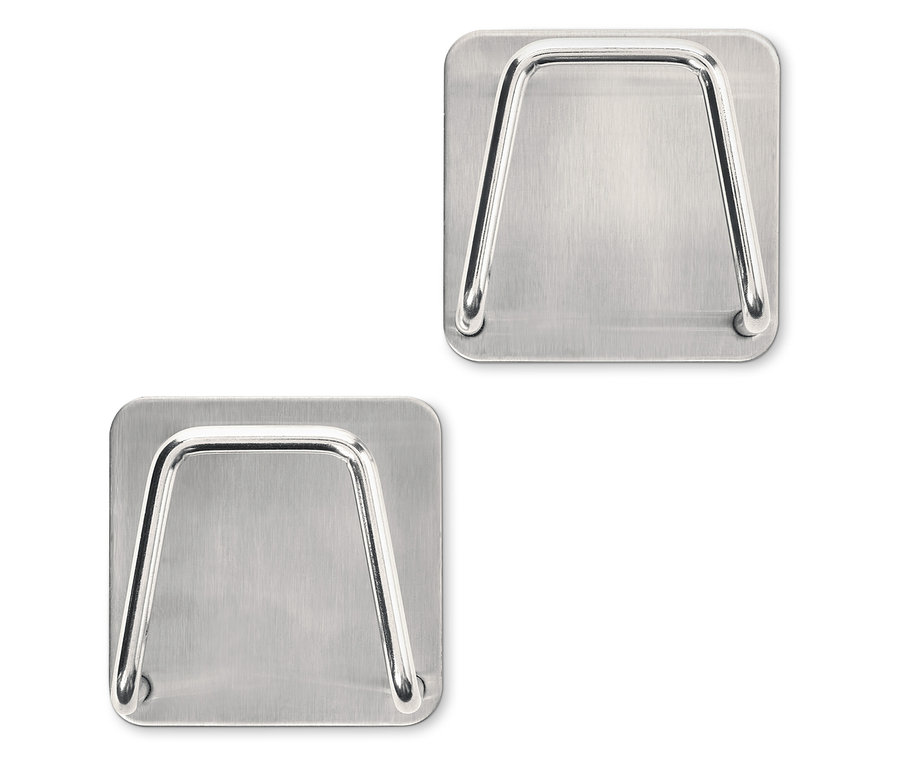 Dwa uchwyty na gąbki ze stali nierdzewnej.