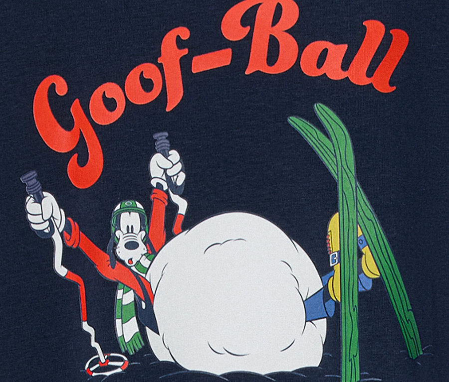 Postać z kreskówki Goofy ze sprzętem narciarskim w śnieżnej scenerii z napisem "Goof-Ball".