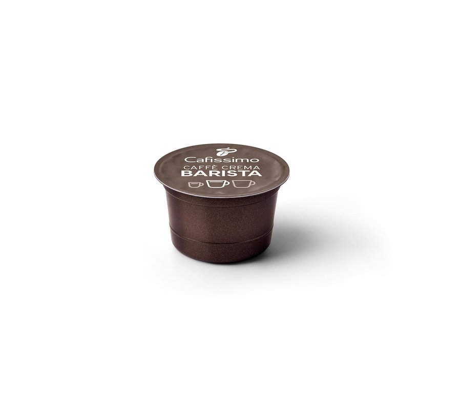 Zbliżenie na pojedynczą, brązową kapsułkę BARISTA Caffè Crema.
