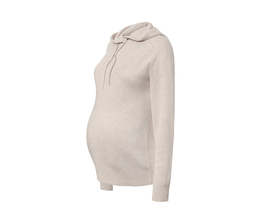 Beżowy dres ciążowy z kapturem i długimi rękawami.