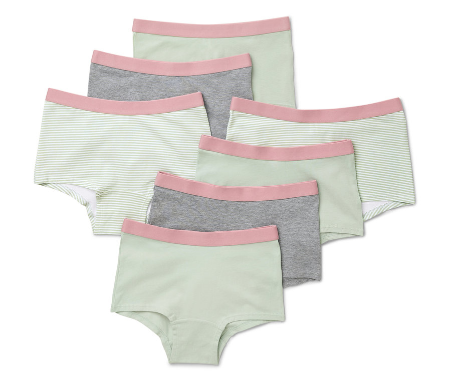 Siedem miętowych majtek dziewczęcych leży na sobie.