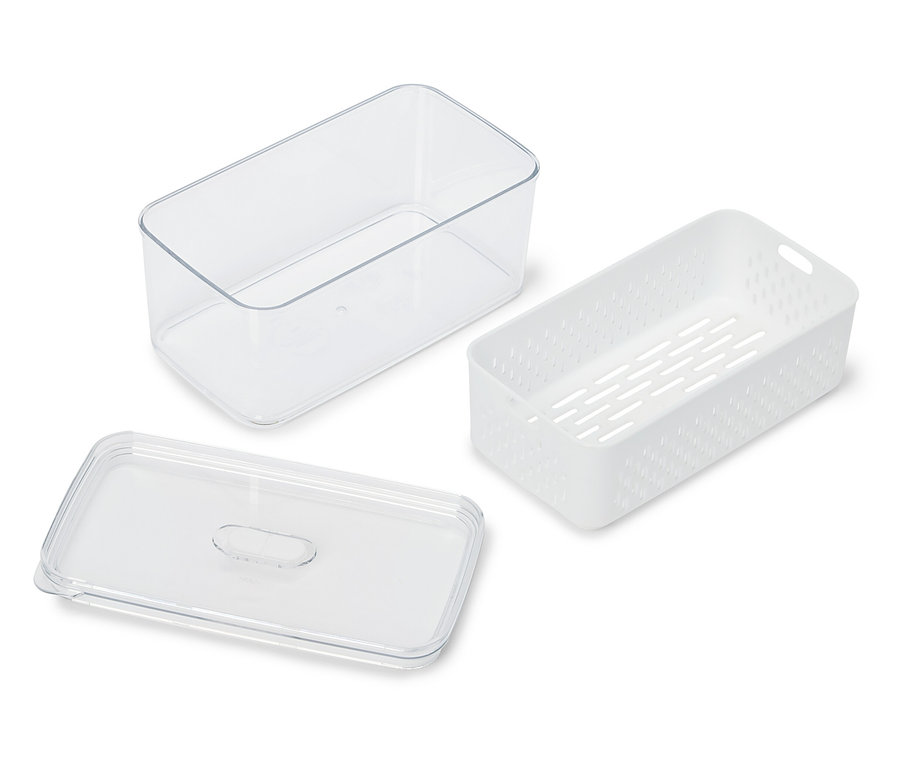 Przezroczysty pojemnik, biały perforowany pojemnik i przezroczysta pokrywka leżą na białej powierzchni.