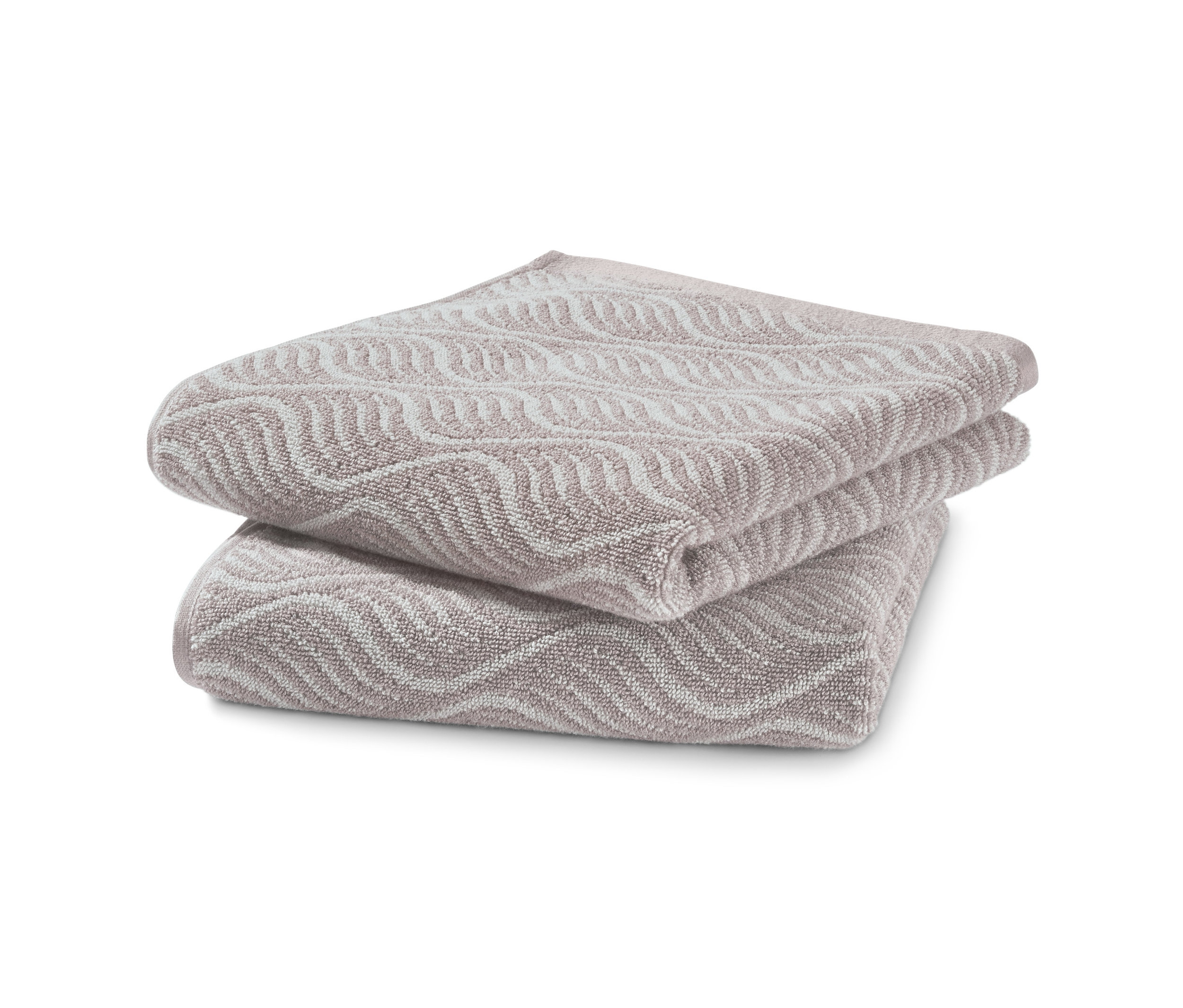 Dwa żakardowe ręczniki złożone na sobie.