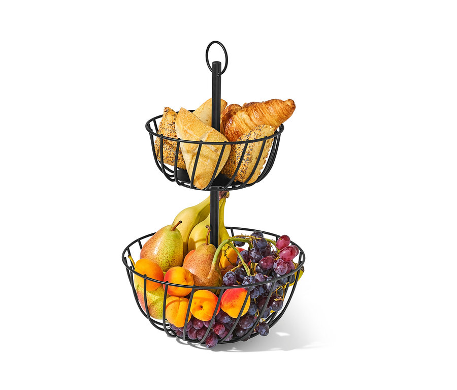 Dwu poziomowa etażerka z owocami i pieczywem.