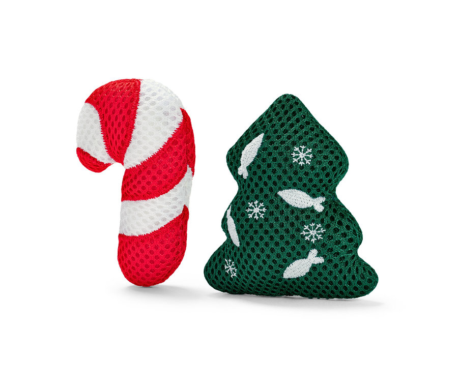 Zabawka dla kota w kształcie czerwono-białej laski cukrowej i zielonej choinki.