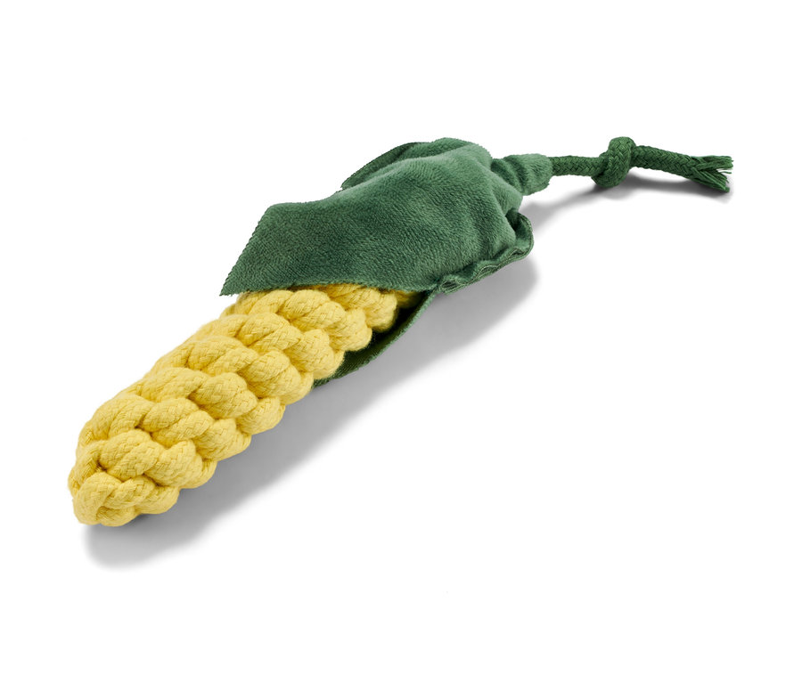 Zabawka dla psa „kukurydza” leży na białym tle.