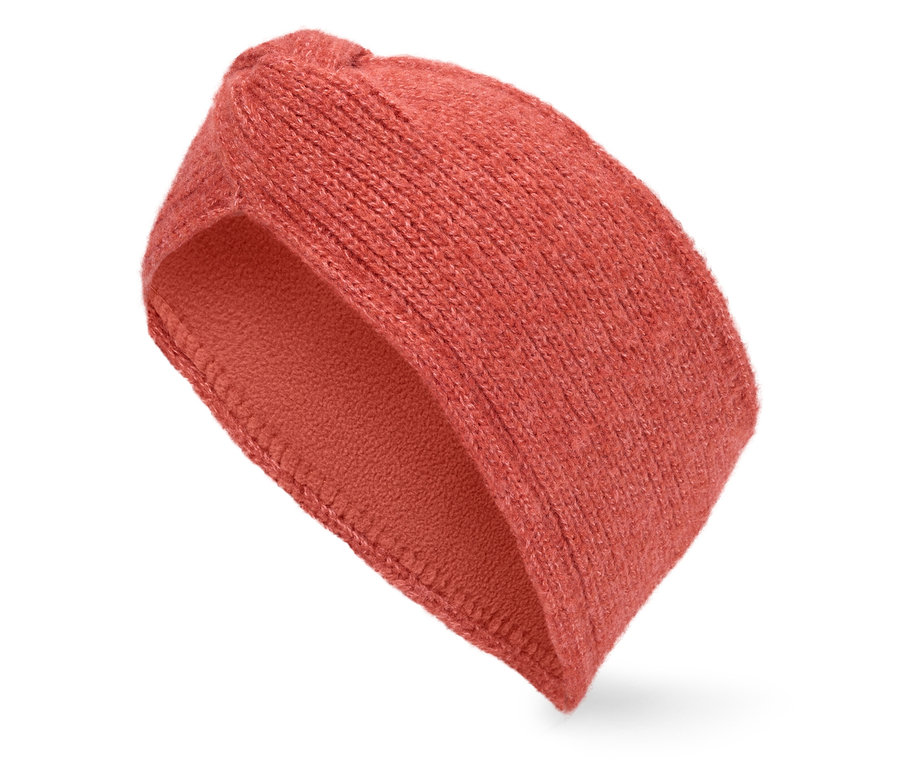Pomarańczowa dziergana opaska na głowę na białym tle.