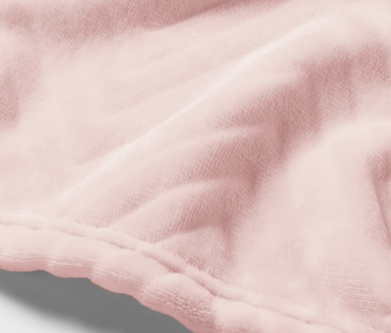 Zbliżenie różowej tkaniny aksamitnej ze szwem.