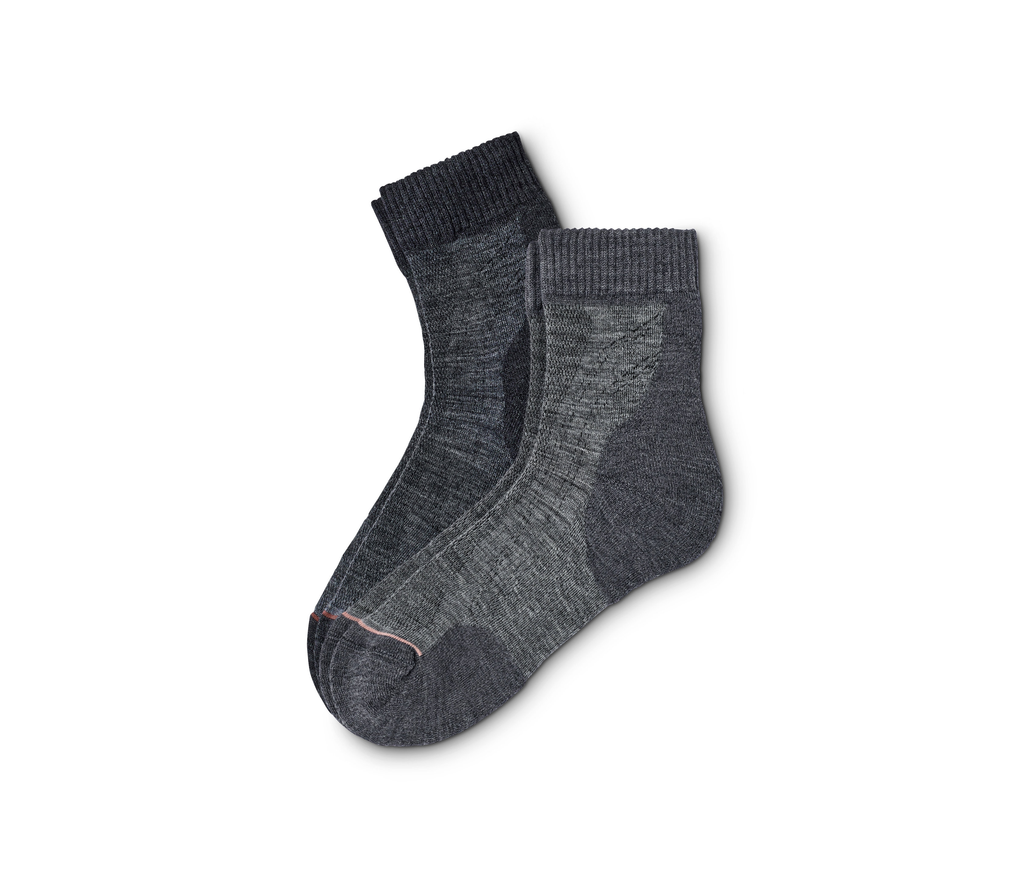 Dwie pary skarpet turystycznych z wełną leżą na sobie.